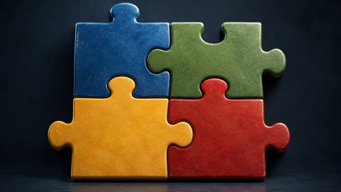 قطع أحجية بأربعة ألوان تتجمع في شكل واحد